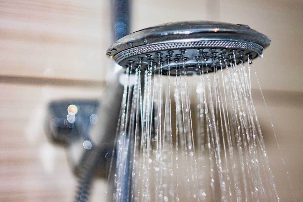 Water flowing from a household showerhead